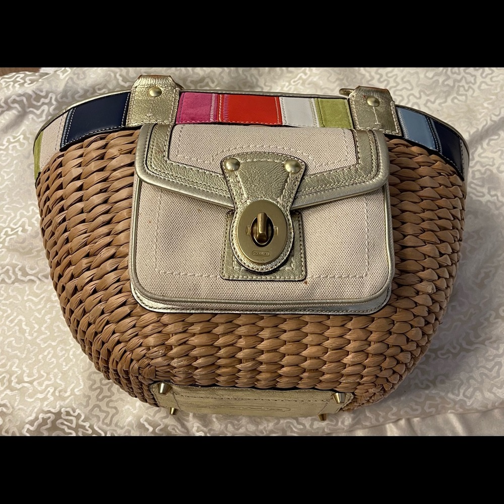 Beautiful straw Coach handbag tote.  Good used condition w/ some marks inside.